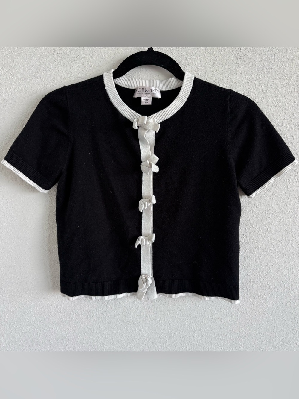Forward bow cardigan